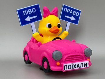 Утка-девочка в розовом авто &laquo;Лево-Право&raquo; на торпеду DUCKAUTO-001 фото